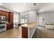 Kitchen featuring a large island with granite countertops and stainless steel appliances at 5032 Beach River Rd, Windermere, FL 34786