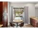 Kitchen nook featuring a round table with seating and a sliding glass door to the screened patio at 5032 Beach River Rd, Windermere, FL 34786