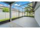 This screened patio provides a perfect outdoor living space for relaxation and entertainment at 5032 Beach River Rd, Windermere, FL 34786