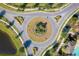 Aerial view of community roundabout with professionally designed beds and landscaping in a desirable neighborhood at 5306 Rochester Pl, St Cloud, FL 34771