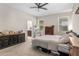 Comfortable bedroom featuring neutral tones, plush carpet, and a view to the ensuite bathroom at 5306 Rochester Pl, St Cloud, FL 34771