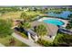A view of the community pool, clubhouse, playground, and picnic area, surrounded by lush landscaping at 5306 Rochester Pl, St Cloud, FL 34771