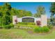 Landscaped entrance to Lancaster Park East, with lush greenery and manicured lawns at 5306 Rochester Pl, St Cloud, FL 34771