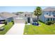 Charming single-story home with a well-manicured lawn, a two-car garage, and a welcoming entrance at 5306 Rochester Pl, St Cloud, FL 34771