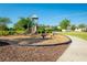 Community playground with slides, spring riders, and a wood chip surface surrounded by green space at 5306 Rochester Pl, St Cloud, FL 34771