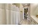 Bright bathroom with a shower and access to the walk-in closet at 600 Buchannan Dr, Davenport, FL 33837