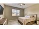 Bedroom with neutral tones, a ceiling fan, and natural light at 600 Buchannan Dr, Davenport, FL 33837