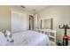 Inviting bedroom with a white bed, large mirror, exercise bike, and view of the closet at 600 Buchannan Dr, Davenport, FL 33837