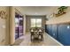 Dining area with natural light, blue accent wall, and tile flooring at 600 Buchannan Dr, Davenport, FL 33837