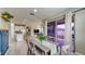 Dining area featuring sliding glass door, tile flooring open to the kitchen and living spaces at 600 Buchannan Dr, Davenport, FL 33837