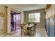 Cozy dining area with sliding glass doors to patio and tile flooring at 600 Buchannan Dr, Davenport, FL 33837