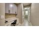 Hallway with a built-in desk area and access to the bathroom at 600 Buchannan Dr, Davenport, FL 33837