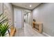 Hallway features tile flooring, neutral paint, and tasteful decor leading to other areas at 600 Buchannan Dr, Davenport, FL 33837