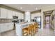 Kitchen featuring white cabinets, stainless steel appliances and a center island with bar seating at 600 Buchannan Dr, Davenport, FL 33837