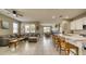 Open-concept living area with a sectional sofa, kitchen bar, and dining space at 600 Buchannan Dr, Davenport, FL 33837