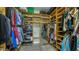 Organized walk-in closet with custom shelving and storage for clothes and shoes at 600 Buchannan Dr, Davenport, FL 33837