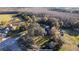 Aerial view of a home with a large yard, nestled among mature trees and landscaping at 6917 Roman Ct, Clermont, FL 34714