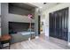 This bedroom showcases a built-in bunk bed with hardwood floors and black closet doors for a modern and stylish look at 6917 Roman Ct, Clermont, FL 34714