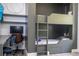This bedroom features a bunk bed with a built-in desk area, perfect for or guests, complemented with hardwood floors at 6917 Roman Ct, Clermont, FL 34714