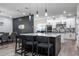 Modern kitchen with a large island, sleek countertops, and stylish pendant lighting at 6917 Roman Ct, Clermont, FL 34714