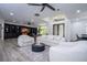 Spacious living room with built-in shelves, high ceilings, and a cozy seating area at 6917 Roman Ct, Clermont, FL 34714