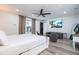 Open main bedroom with sitting area and TV, offering a relaxing retreat at 6917 Roman Ct, Clermont, FL 34714