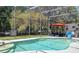 This screened in backyard features a pool with a table and seating area, perfect for outdoor entertaining or relaxation at 6917 Roman Ct, Clermont, FL 34714