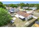 The home features an enclosed back patio, a shed, and mature trees, offering an inviting outdoor space at 7974 Village Green Rd, Orlando, FL 32818