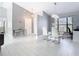 Stylish dining space with a modern glass table, sleek chairs, and contemporary decor, perfect for entertaining at 7974 Village Green Rd, Orlando, FL 32818