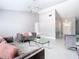 Spacious living room featuring modern decor, a comfortable sofa, and stylish lighting, perfect for relaxation at 7974 Village Green Rd, Orlando, FL 32818