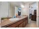 Bathroom vanity with double sinks, granite countertop, and spacious mirror at 8067 Crushed Pepper Ave, Orlando, FL 32817