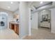 Hallway with tiled floors, archways, and built-in desk space at 8067 Crushed Pepper Ave, Orlando, FL 32817