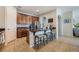 Kitchen island with dark granite counters, stainless steel appliances, and bar stool seating at 8067 Crushed Pepper Ave, Orlando, FL 32817