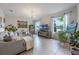 Bright living room with tile flooring, neutral paint, large windows, and stylish decor at 8067 Crushed Pepper Ave, Orlando, FL 32817