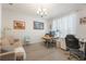 Well-lit office space featuring a comfortable seating area and functional workspace at 8067 Crushed Pepper Ave, Orlando, FL 32817
