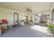 Outdoor patio space with barbecue grill, ceiling fan, and seating at 8067 Crushed Pepper Ave, Orlando, FL 32817