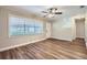 Inviting living room showcasing new flooring, large windows, and neutral decor at 811 S Lone Oak Dr, Leesburg, FL 34748