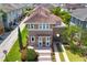 Charming home with lush landscaping, portico, arched car port, and clay tile roof in a well-manicured neighborhood at 8268 Bellow St, Orlando, FL 32827