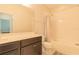 Well-lit bathroom with a vanity, mirror, and shower-tub combination, offering a clean and functional design at 8268 Bellow St, Orlando, FL 32827