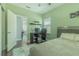 Bedroom featuring desk with computer, ceiling fan, and hardwood floors at 8268 Bellow St, Orlando, FL 32827