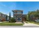Charming two-story home featuring a tile roof, covered carport, and inviting front entrance with beautiful landscaping at 8268 Bellow St, Orlando, FL 32827
