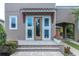 Welcoming front entrance features tiled steps, a covered porch, and a view of the attached carport at 8268 Bellow St, Orlando, FL 32827