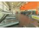 Well-equipped community gym with treadmills and weight machines in a spacious layout with natural light at 8268 Bellow St, Orlando, FL 32827
