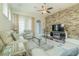 Stylish living room with a decorative stone accent wall, fireplace, hardwood floors, and comfortable seating at 8268 Bellow St, Orlando, FL 32827