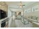 Inviting living room with a decorative stone wall, fireplace, hardwood floors, and ample natural light at 8268 Bellow St, Orlando, FL 32827