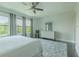 Spacious main bedroom featuring natural lighting, hardwood floors, and decorative rug at 8268 Bellow St, Orlando, FL 32827