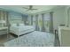 Spacious bedroom with a king-size bed, carpet, soft natural light, and neutral décor at 8268 Bellow St, Orlando, FL 32827