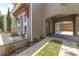 Side view of the home showing the porte cochere and landscaped walkway at 8268 Bellow St, Orlando, FL 32827