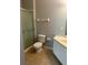 Functional bathroom with shower, toilet, and vanity with sink, tiled floor at 8775 Sartori St # 307, Orlando, FL 32829