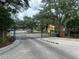 The entrance to the neighborhood featuring a black gated entry on a paved road at 8775 Sartori St # 307, Orlando, FL 32829